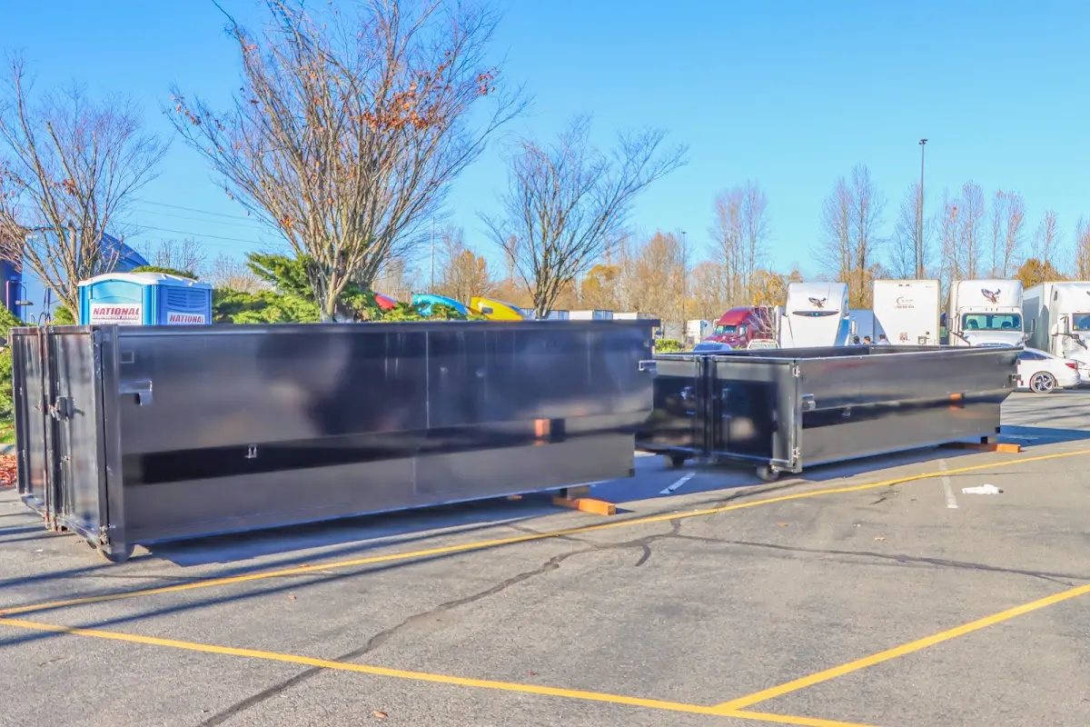 Professional dumpster rental service with roll-off container on residential driveway in Palmetto